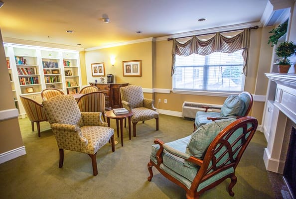 Interior common area with seating and bookshelves