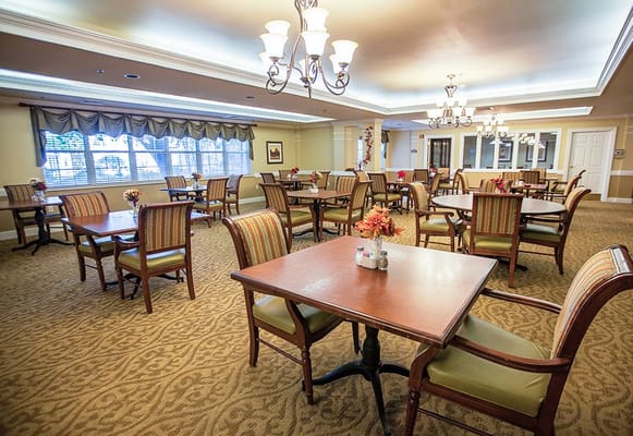 Dining area with tables and chairs arranged neatly