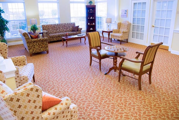 Comfortable common area with seating in a senior living facility