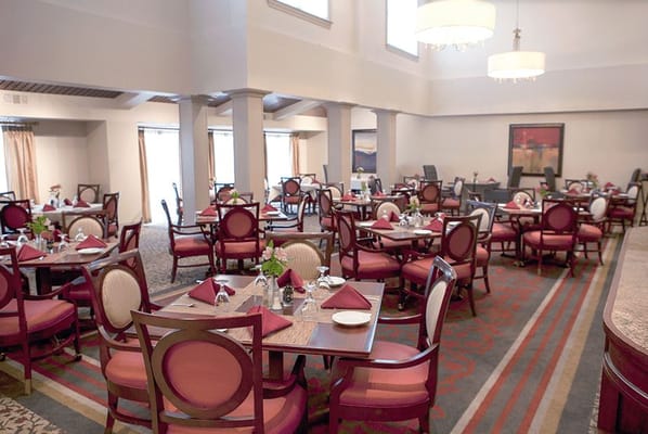 Dining room setup with elegant tables and chairs