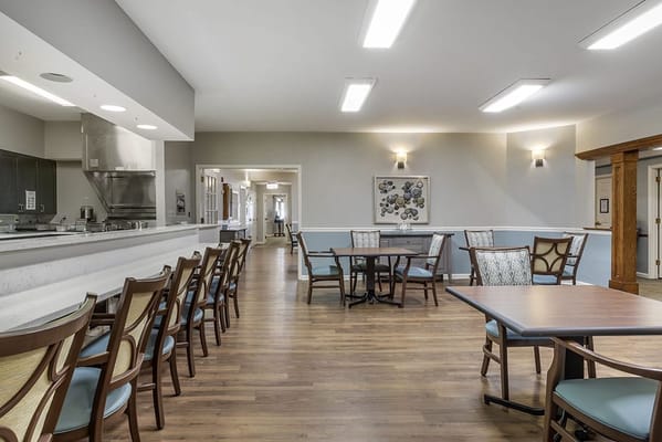 Bright common area with tables and chairs