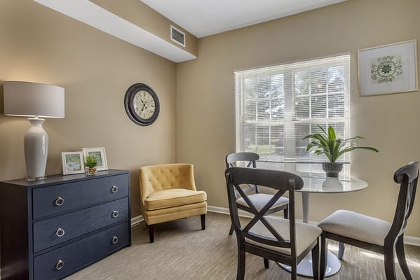 Cozy common area with light-colored walls and furniture