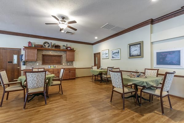 Bright dining area with tables and chairs