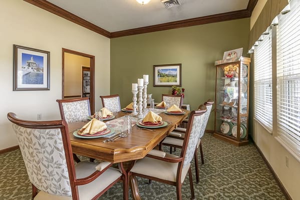 Dining area with elegantly set table and decor