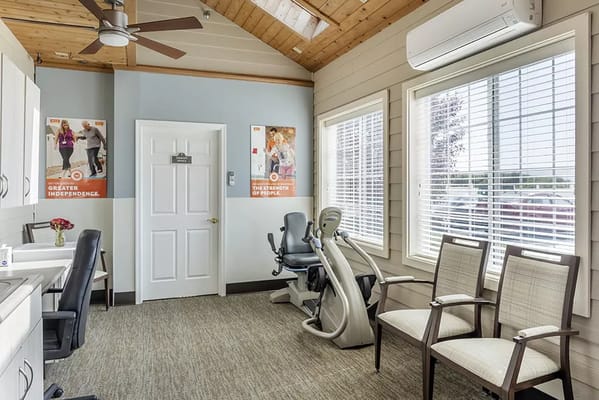 Interior view of an exercise room with fitness equipment