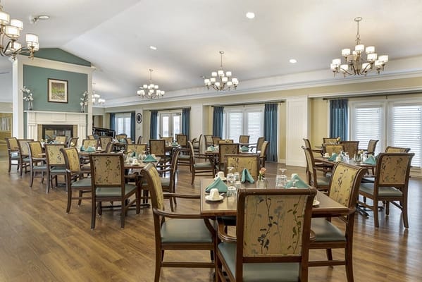 Bright dining area with well-set tables and chairs