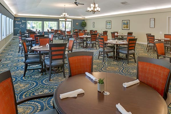 Bright dining room with tables and chairs