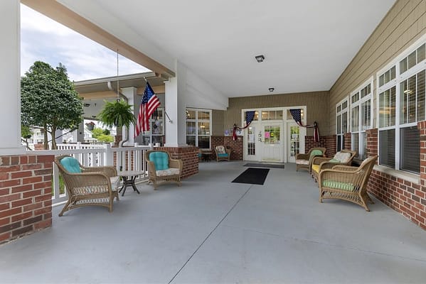 Outdoor seating area with comfortable chairs and plants