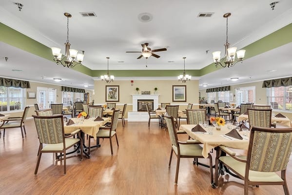 Bright dining room with tables set for meals.