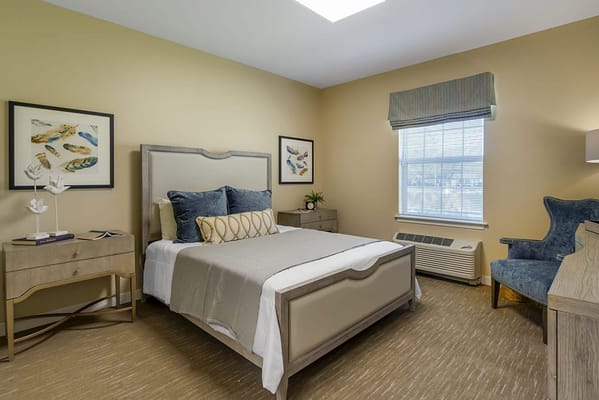 A well-furnished resident bedroom in a senior facility
