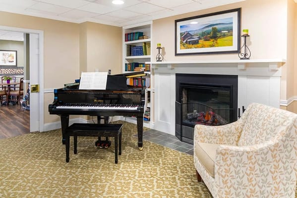 Cozy common area with a piano and comfortable seating
