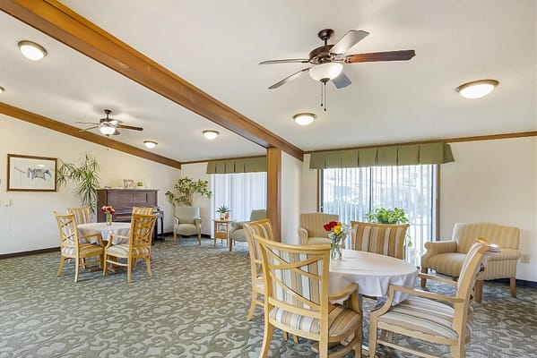 Bright common area with tables and chairs