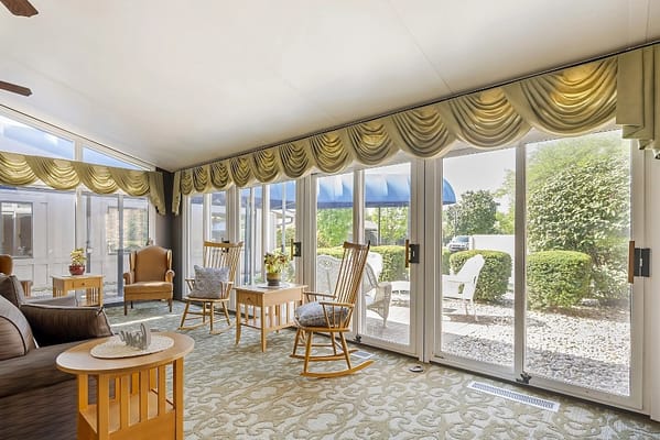 Bright common area with seating and outdoor view