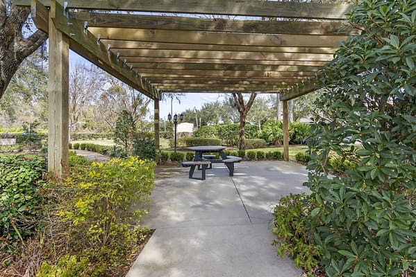 Shaded outdoor seating area in a landscaped garden