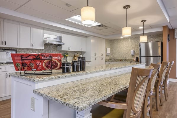 Bright, modern kitchen area with seating
