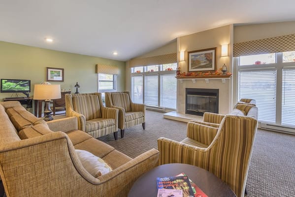 Cozy common area with comfortable seating and a fireplace