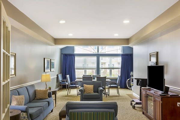 Bright common area with seating and dining space