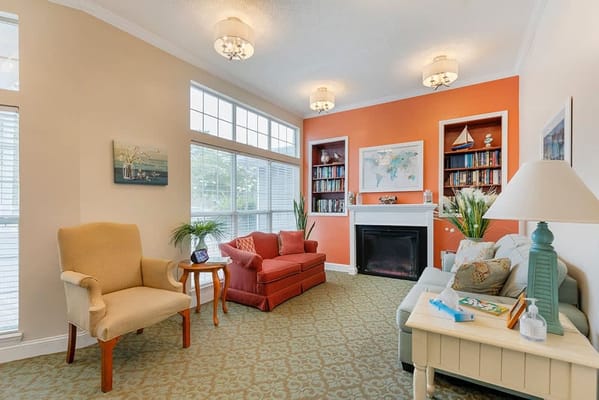 Cozy common area with seating and bookshelves