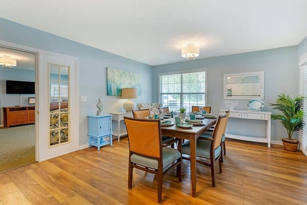 Bright dining room with a set table