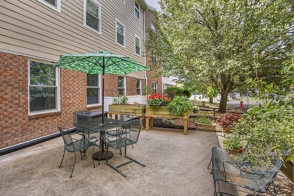 Outdoor patio area with seating and plants