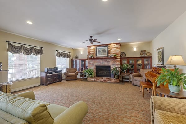 Cozy common area with seating and a fireplace