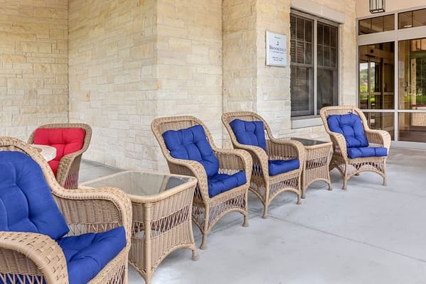 Outdoor seating area with wicker chairs