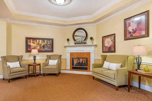 Cozy common area with comfortable seating and a fireplace