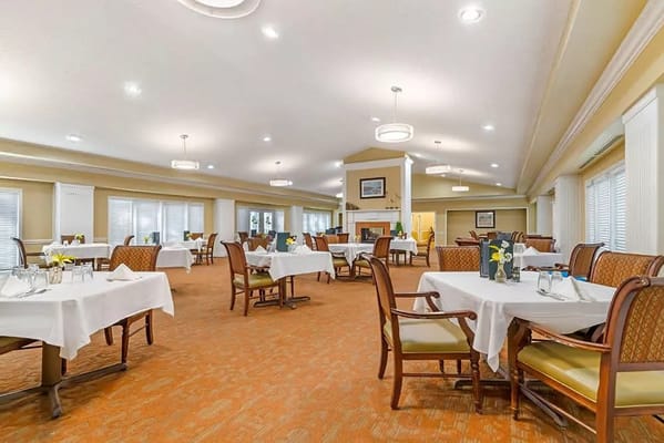 Bright dining room with set tables and seating