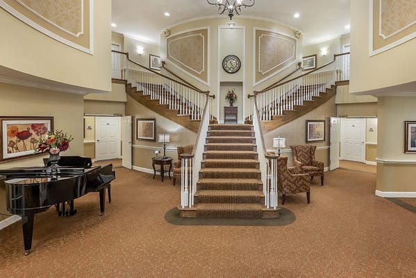 Elegant lobby with a staircase and piano