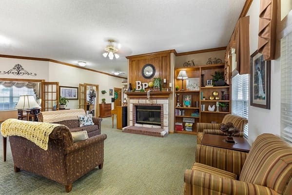 Cozy common area with seating and bookshelves