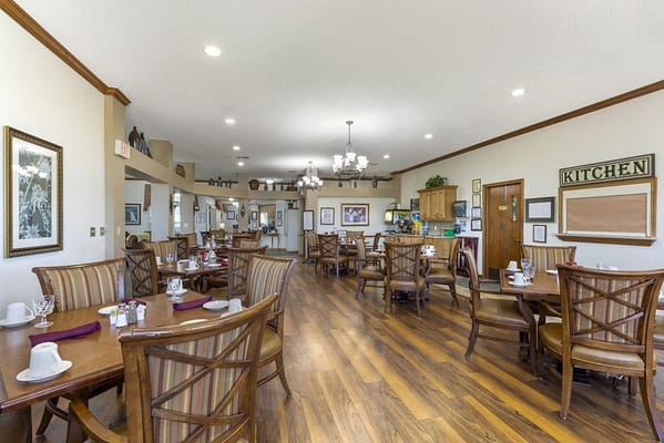 Dining room with tables set for residents