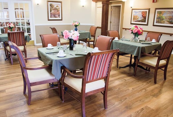 Dining area with tables and floral centerpieces
