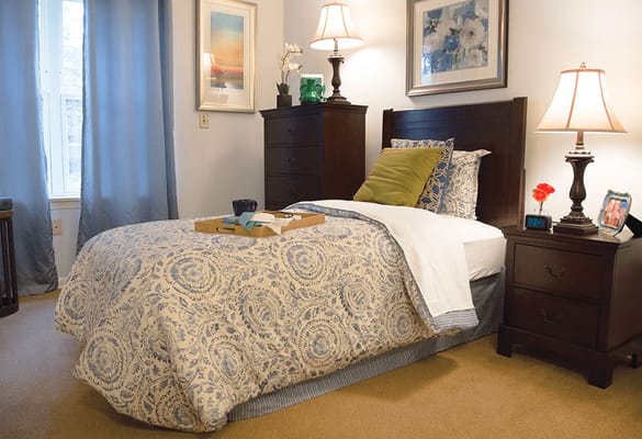 Cozy resident room with bed and furnishings