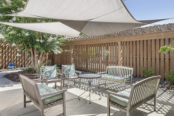 Outdoor seating area with shaded lounge chairs
