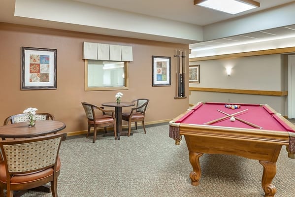 Common area with a pool table and seating