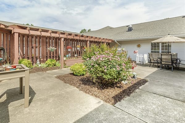 Outdoor courtyard with flowers and seating area