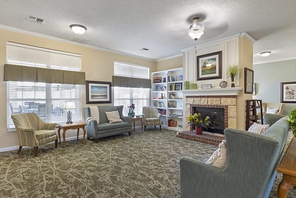 Cozy common area with seating and bookshelves