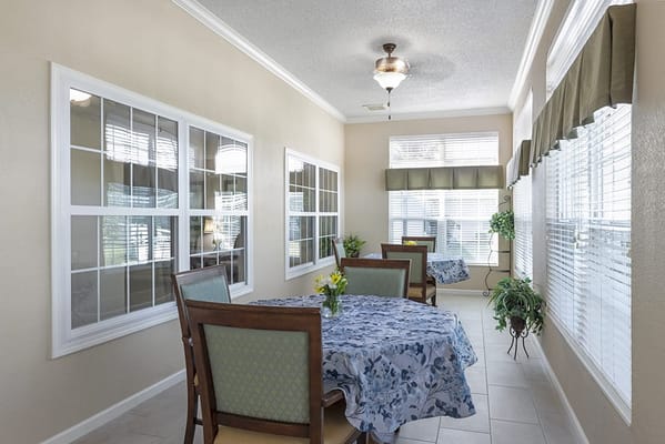 Bright interior common area with tables and plants