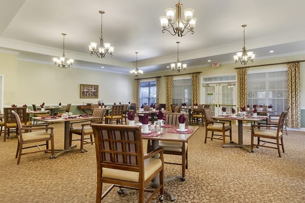 Dining room setup with tables and chairs