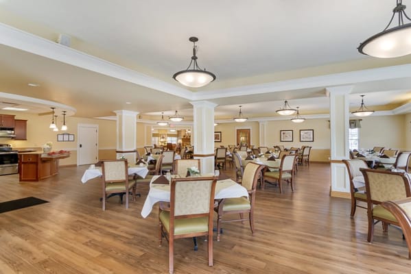 Bright dining room with tables and chairs