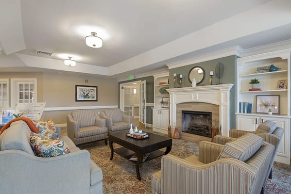 Comfortable common area with seating and fireplace