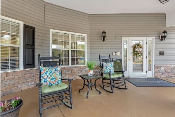 Front porch area with rocking chairs and decor