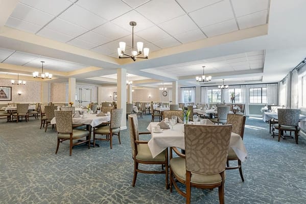 Dining area set up with tables and chairs
