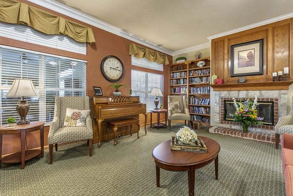 Cozy common area with seating and bookshelves