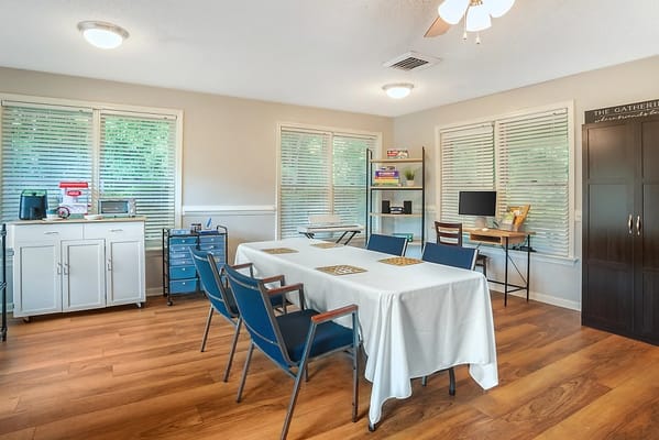 Interior view of a common area with tables and chairs