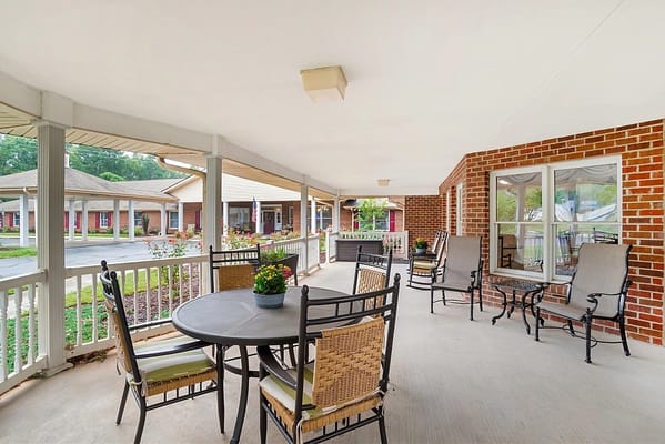 Outdoor seating area with tables and chairs