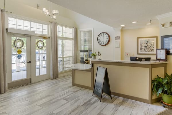 Lobby area with reception desk and large windows