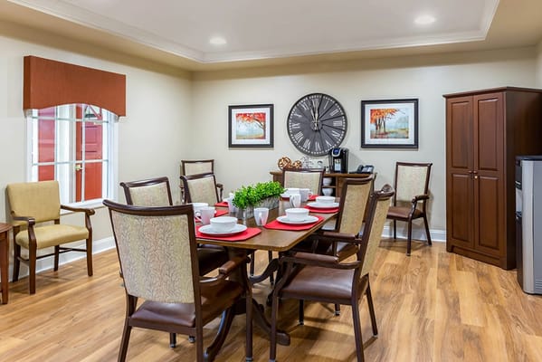 Cozy dining area with table set for meals