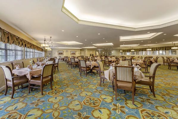 Dining room setup with tables and chairs