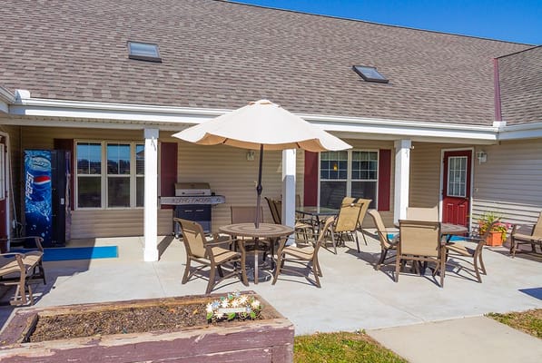 Outdoor seating area with tables and umbrellas